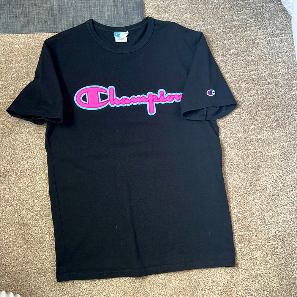 Pink and blue embroidered champion shirt.